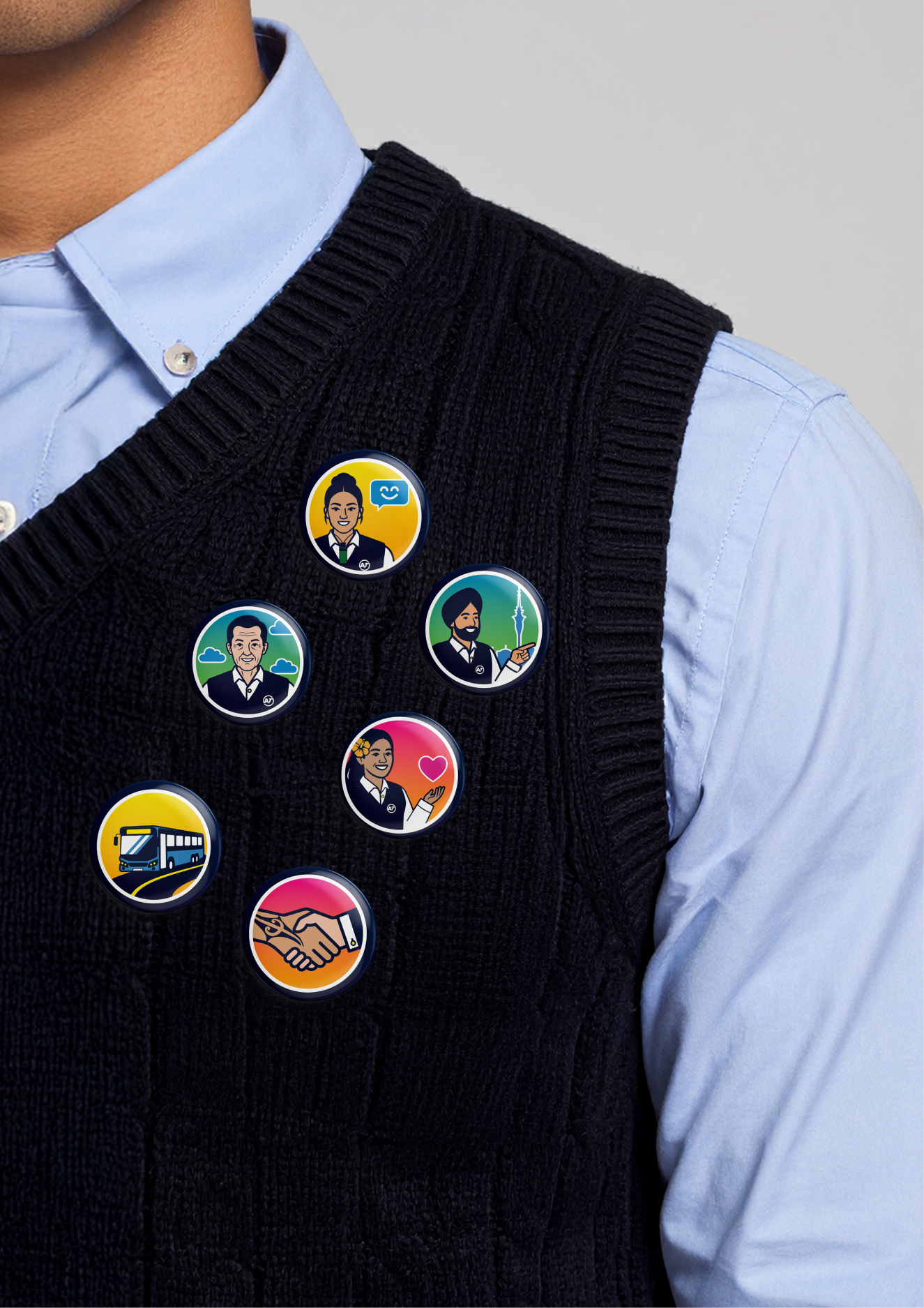 Close-up of achievement badges on a driver's uniform shirt.